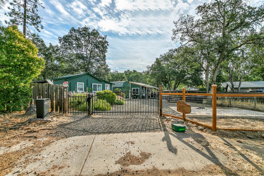 Come to Shady Cove! A quiet river town flowing with tourism and waiting for your presence. This lovely home has been extensively updated and just about everything you see is new, including roof, windows, engineered vinyl plank flooring, water heater, 3-mini splits for heating and air-conditioning, exterior Hardiplank concrete siding, cabinets, and attic insulation. The kitchen has a butcher-block island, copper farmhouse sink, granite counters, and is served by a propane gas stove. Enjoy a reverse osmosis water filter system to ensure you are drinking the finest water available ($1,800 value). Primary bath is all new with solid surface counter over new vanity.  The living areas are very open and flow nicely into the kitchen. Outside is a clean slate for the new owners to paint the landscape. There are two storage sheds, a new 6'' concrete slab ready for a garage or carport, and the driveway has a solar powered security gate. Grab your fishing pole and raft and experience Shady Cove!