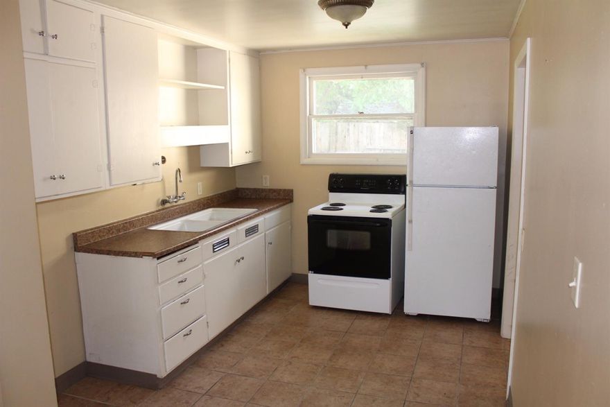 Great Opportunity at a great price. 2 beds, 1 bath, plus a den. Large backyard with detached storage shed. This home has tons of potential and would make a great starter home or rental for someone.