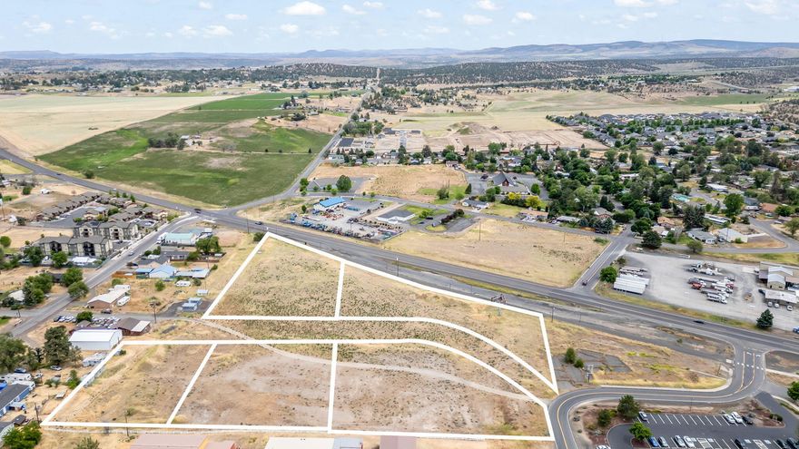Rare opportunity with over 6.5 acres of prime commercial land, with complete plans and approval from the city for a storage unit development. Comprised of 5 parcels that can be utilized collectively or individually, this property offers endless potential. This property is zoned C-1, permitted uses are retail, restaurant, offices or public use.