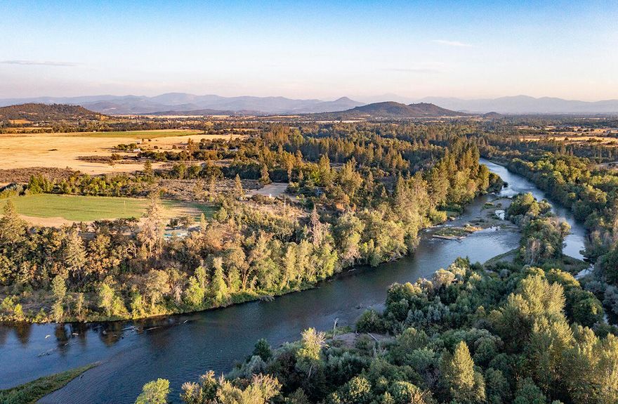 AUCTION BIDDING OPEN! Bidding ends 12/14/23. Previously Listed $10,995,000.Current High Bid $4,000,000. No Reserve. Showings by Appointment.  Showings by appointment. This gorgeous ranch just outside Medford, Oregon, has been owned for the last thirty years by actor Patrick Duffy and is one of the most pristine properties in the area. This property combines privacy, security, and luxury with nine parcels, two homes, and two guest cabins all set on two miles of Rogue River frontage. The primary residence is built in a lodge style on 79 acres of riverfront, that is dividable into five-acre lots and has an art gallery and pool. The buildings feature beautiful wood and river rock blend with the stunning natural surroundings, and large windows. There are over 100 acres of irrigated grounds and a 2 acre pond for irrigation and recreation.