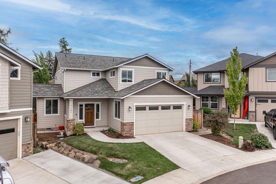 Brand new interior paint & carpet throughout! Don't miss this beautiful custom-designed home tucked into a quiet cul-de-sac while enjoying the conveniences of SW Bend. Built in 2015, the open floor plan and detailed high-end finishes throughout give an instant feeling of home. Interior features include a large entryway, private office, open family/dining room/kitchen, custom built-in shelves surrounding a beautifully mantled gas fireplace, granite countertops, two pantries, master suite with vaulted ceilings, walk-in closet and bathroom with large shower and tub, bonus loft upstairs, custom wainscoting in all bedrooms, epoxy flooring with cabinets and shelving in the garage, and so much more. The home is equipped with several Smart features: Phillip Hue lights, fully automated Hunter Douglass blinds, and a Honeywell Wi-Fi-enabled thermostat. The extended backyard features exquisite landscaping, fire pit area, stream, golf practice area, hot tub, drip irrigation and low voltage lightin