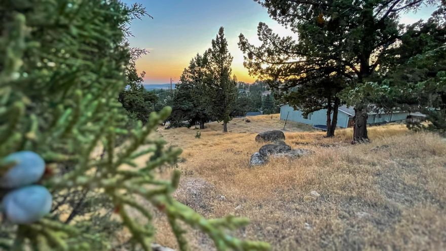Build your dream home or retreat on this slightly sloped lot in desirable Ochoco West. Located near the top of Ochoco West, this property has stunning sunset views just waiting for the perfect home. With water, sewer, and power available at the property line, you  can start planning your build right away. This community offers a peaceful setting just minutes from town, with access to a seasonal pool, clubhouse, stocked fishing ponds, and miles of hiking and riding trails. Whether you're looking for a primary residence, a vacation getaway, or an investment property, this lot provides the perfect opportunity to enjoy the best of Central Oregon living.
