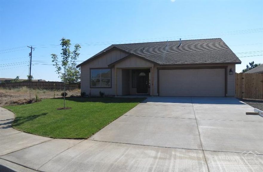 You are going to love this new 3 bedroom, 2 bath home with 1529 SF all on a single level. The master is nice with a vaulted ceiling, double sinks and a walk-in closet. Large living area opens to a huge kitchen and dining area with island and seating area. Covered outdoor living area. Engineered laminate flooring in the living, dining and kitchen areas. Two car attached garage, full landscaping with sprinkler system and fencing. AC is included!!!