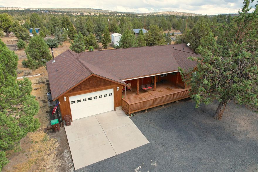 Amazing custom built home on 1.81 acres with access to many miles of BLM land! This beautiful home offers a spacious open floor plan that includes 3 bedrooms/2 full bathrooms, an office and a must see-one of kind-gorgeous bar/game/bonus room with pool table ready for entertaining your family and friends! The spacious and open kitchen overlooks the living room and showcases beautiful Hickory cabinets, corian counters, stainless steel appliances and  pantry. Master bedroom has walk-in closet and sliding doors leading onto the back deck. Master bathroom has double sink vanity with shower/jetted tub. Great sized decks- both front and back are so peaceful and great areas for entertaining too! There's a huge 3 bay shop and also a large barn with a lean-to and attached horse stalls. Large pasture area is ready for cows, horses or 4-H animals. Plenty of room for your ATV's too!  Property is completely fenced! Lots of unique touches that are a must see!