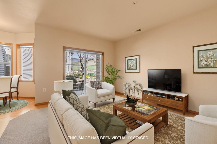 This sunny ground-floor unit offers lots of space for living, work and relaxation. The flexible floor plan includes a living room with half-bath for guests, a dining nook and office, all oriented to catch the beautiful mountain views. A private ground-floor patio off the living room offers easy access to the beautiful grounds for you and a pet. (The association allows two ''household pets.'') The bedroom suite has a spacious walk-in closet and accessible bathroom. The unit has been in the same family since it was built and shows pride of ownership. Upgrades include hardwood flooring and newer furnace. (2021) All appliances included! The association offers dining, fitness/swim facilities and a variety of activities. Seller says you will love the ''extremely educated and interesting'' neighbors.