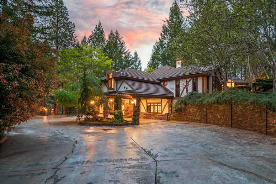 An exclusive retreat tucked away in the foothills outside the charming river-town of Grants Pass; the +/-18 acre estate is among the most impressive properties in the Pacific NW. Featuring levels of luxury usually reserved for five-star resorts, the residence boasts distinguished craftsmanship and absolute privacy with elaborate landscaping, meandering water feature with multiple falls, a state of the art fitness center with indoor pool, 2000 bottle wine cellar, athletic court, gardens, a climate-controlled conservatory, and more. A piece of real estate like this is rare, and provides a discerning buyer with an incredible lifestyle opportunity. The house itself measures over 5,700 SF and is absolutely enveloped in nature. The land and surrounding areas provide the ability to enjoy the benefits of rural living: growing fresh food, outdoor activities like horseback riding, hiking and biking, plus getting away from the fast-paced world to savor the scenery and relaxing small-town culture