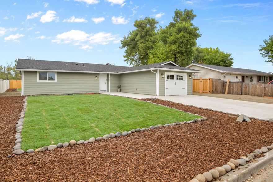 Completely remodeled from the studs up, this beautiful 3 bed, 2 bath home offers 1,144 sq ft of modern living on a generous 0.19-acre lot. Every detail has been updated—new electrical, plumbing, roof, windows, flooring, and more—creating a fresh, move-in-ready space. The open-concept layout features a bright living area, stunning kitchen with granite counters and stainless steel appliances, and stylish finishes throughout. Both bathrooms are fully updated with contemporary fixtures and tile work. Outside, enjoy a large, landscaped yard with room to entertain, garden, play and RV parking. Located in a quiet Eagle Point neighborhood close to parks, schools, and shopping. Offered at $349,000, this home is a rare find!