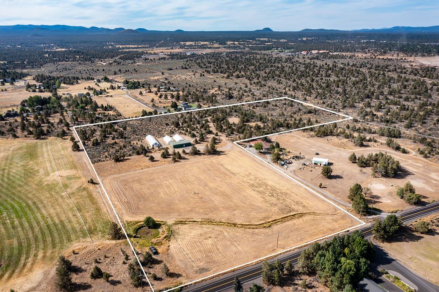 Your dream property awaits! This one of a kind 26.22 +/- acre property is a short 3 miles from Costco! Featuring breathtaking 10 mountain views this property highlights a large, enclosed barn with an attached/insulated shop with electricity and mini split already in place. Conditional use permit to build house is valid until Jan. 2024 and can be extended if needed. The home site is 1.7 +/- acres and has Avion water, underground power and new septic system already installed and ready to hook-up. There is a 7.53 +/- acres irrigated fenced pasture with newer Irrigation pump, wheel line and 3 – 2,500 gallon irrigation holding tanks included. Also included are house plans for a single level 2,644+/- sq ft home with 3 car garage. This is a must see property with amazing views! Don't let this rare opportunity to own acreage close to town pass you by! Financing available from Mid Oregon with 35% down.