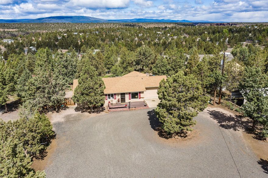 Welcome to your dream home! This charming 3-bedroom, 2-bath house has been renovated, including a newer heat pump. Enjoy your morning coffee in the cozy sunroom. This home features a spacious 2-car garage, and an impressive 1,296 sq ft detached workshop/garage—ideal for all your toys and projects. Enjoy RV hookups and power for convenience. Step outside to soak in the stunning Cascade mountain views from your Trex deck, all set in a beautifully landscaped fully fenced yard, including a pergola green house, and additional fenced area ideal for a garden or pets. This is the ultimate home for peace & serenity! Ask about our preferred lender credit of 1% towards closing costs.