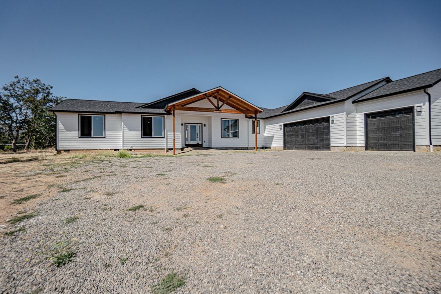 New Home Situated On 2.5 Acres In The Desirable West Hills Of Central Point With Views Overlooking The Valley, Table Rocks, & Mt McLoughlin. This single level home offers a large kitchen with open floor plan and vaulted ceiling perfect for entertaining. Equipped with gas cooktop, double ovens, beverage fridge in island, pass through window to outdoors and tons of storage.  The home has 5 bedrooms, 4.5 baths (one bathroom being outdoors for entertaining), primary suite is set up your own private hideaway, includes 2 walk in closets, double vanity, large tile walk in shower. Large laundry with plenty more storage cabinets and deep sink, and a 3 car garage for all the toys. The outside area offers a large covered patio and pool area, plenty of RV parking and RV hookups. New septic and new holding tank at the well installed. Home completed in 2023, Seller credit towards landscaping and pool refinishing is negotiable with strong offer. 
Listing Agent Is Seller