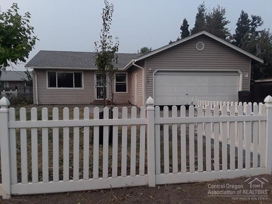 Incredible deal for this 3 bedroom 1 bathroom home in Redmond. Peach, Plum trees in backyard. Perfect for family or as rental property. Home is in process of some repairs, dishwasher and stove have been removed and are being newly replaced. Wood flooring being repaired where missing, kitchen cabinet doors painted and re-installed, and counters being replaced with attractive granite/wood look tile. Utility room with exterior entrance, fully fenced front and back. Perfect backyard for garden, play area.