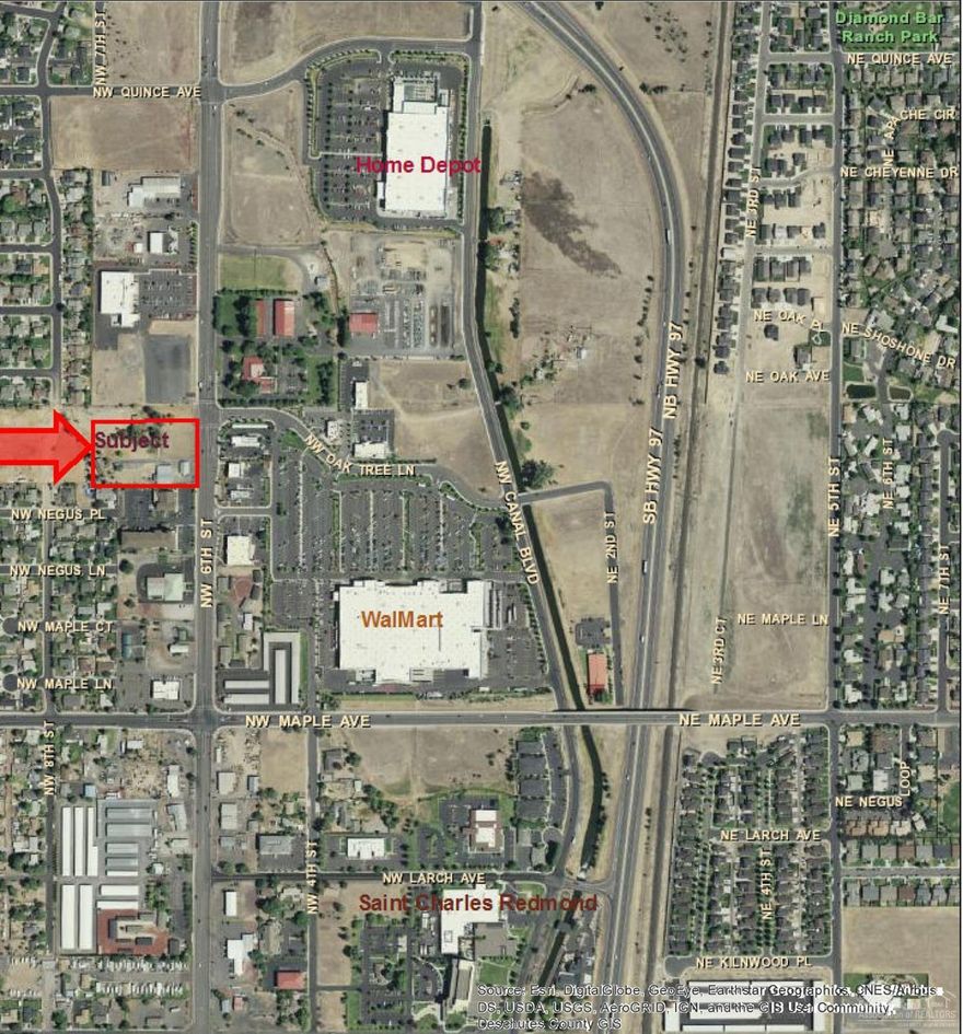 Prime commercial development land on lighted intersection across from Wal-Mart! Some residential on land now, but value in the property.