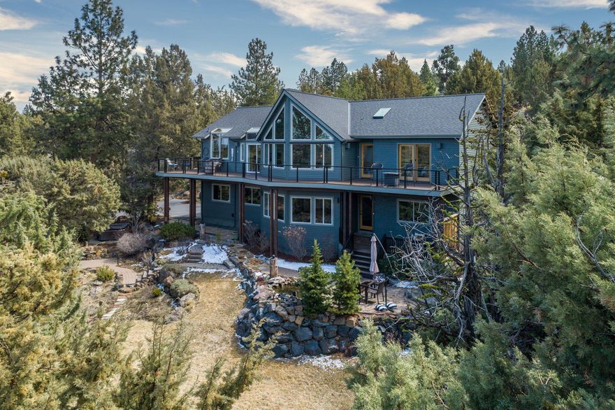 Enjoy life in this spectacular home designed to capture epic sunsets & captivating mountain views from nearly every room. Step into the main level featuring massive windows that expand through the chalet style living room, vaulted primary bedroom, & kitchen filling the home w/ natural light & the snow capped Sisters, 3 finger Jack & more. This ideal floor plan is great for year-round entertainment. A large dining area & kitchen lead to the vast deck overlooking the pines, perfect for enjoying sunsets. 2 bedrooms & family room await w/ scenic views overlooking a manicured lawn, flagstone outdoor dining area, water feature, & private hot tub. Blocks away from Deschutes River Trail access! Need room for your SPRINTER VAN? This XL 3-car tandem garage features a 10-ft door & is deep enough to fit your sprinter & all your outdoor gear. Recent updates include a new roof & new ext. & int. paint in 2021, updated carpets, LVP flooring, & refinished hardwoods. This home is a must see!