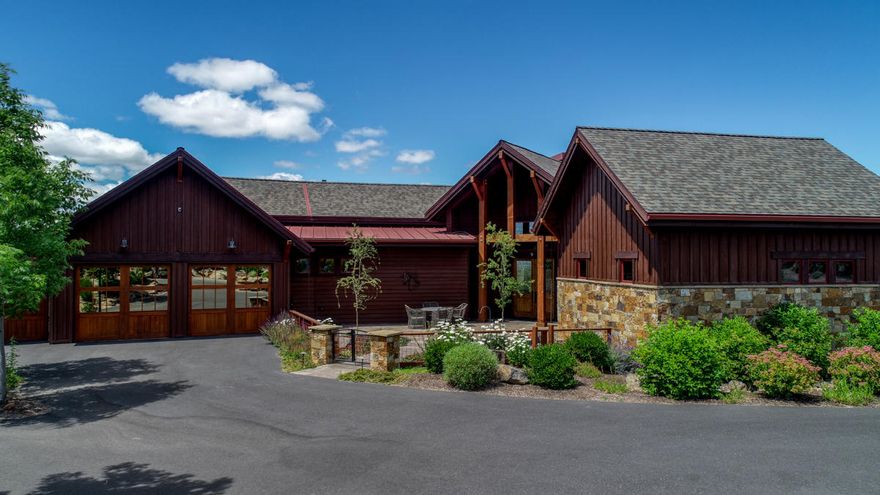 This beautiful one-level home is an entertainer's dream come true. As you walk into the foyer, you are greeted by a large great room with vaulted ceilings featuring gorgeous 19th century wood beams, English Oak hardwood floors and a floor to ceiling stone hearth fireplace. The Chef's kitchen has granite countertops, two islands, beautiful wood cabinetry, GE Monogram stainless steel appliances and a large walk in pantry. The large westerly facing windows in the great room area show off the gorgeous Cascade Mountain views. Heading out to the patio that wraps around the back side of the home and features several sitting areas, an outdoor BBQ kitchen, one can imagine the stunning sunsets to be enjoyed. The stunning landscaping adds to the outdoor living space. The master suite proves to be a quiet oasis with a large spacious walk-in closet, two separate vanities in the bathroom and lovely glass shower. Your guests will enjoy their privacy in their en suite quarters on the opposite side of