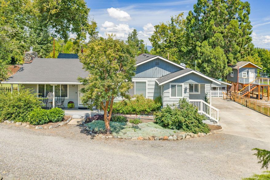 Beautifully renovated home on 2.23 irrigated acres just minutes from town with amazing views of Mt. McLoughlin! This move-in ready home features engineered hardwood floors, a gas fireplace, and a fully updated kitchen with new cabinetry, granite counters, stainless steel appliances, 5 burner gas range, range hood, and built-in pantry. Offering 4 spacious bedrooms and 2 updated bathrooms. The primary suite has ample closet space and a private entrance to the outdoors. Exterior highlights include a year-round pond, irrigated and fully fenced pasture, mature landscaping complete with fruit trees and grape vines, a barn with chicken coop, storage shed, and a newly built treehouse. Private, peaceful, and beautifully maintained—rural living with modern comforts. Call today to schedule a showing!