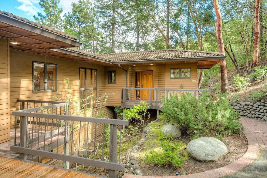 Stunning quality home built by the Shostrom Brothers offering over 3000 square feet of living. Mountain views from endless wood windows, fir doors and trim and hardwood floors throughout much of the home. This well-appointed home exudes quality and gives the sense of living amongst the trees. On the main level you will find the spacious living room with large windows, fireplace, and sliding glass doors to 2 decks and separate patio. The open kitchen with cherry cabinetry has an eating nook, additional private patio and amazing views from the large windows. The lower level master suite features a fireplace, private patio, and beautiful bathroom with soaking tub, separate tile shower and additional large windows to bring the outside in. The lower level offers 2 additional bedrooms, a full bath, laundry room and a spacious family room with wet bar. A 2 car garage, mud room, ample storage, and new flooring and paint just add to the value of this move in ready home.