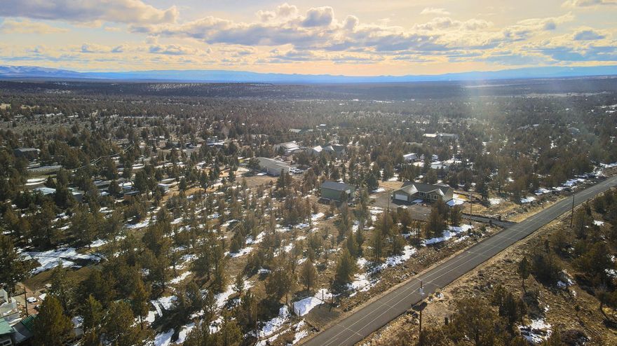 Buildable, fenced and gated 1.71 +/- acre lot in Prineville Lake Acres. Located on a quiet road. Panoramic views of Cascades to the west and Smith Rock to the north from above tree level, peekaboo views from ground level. Electricity is at the street. Take advantage of the close proximity to the nearby reservoir and BLM land for all your outdoor activities. Bring your horses, boats, ATV's and build your dream home. Seller is open to owner carry.