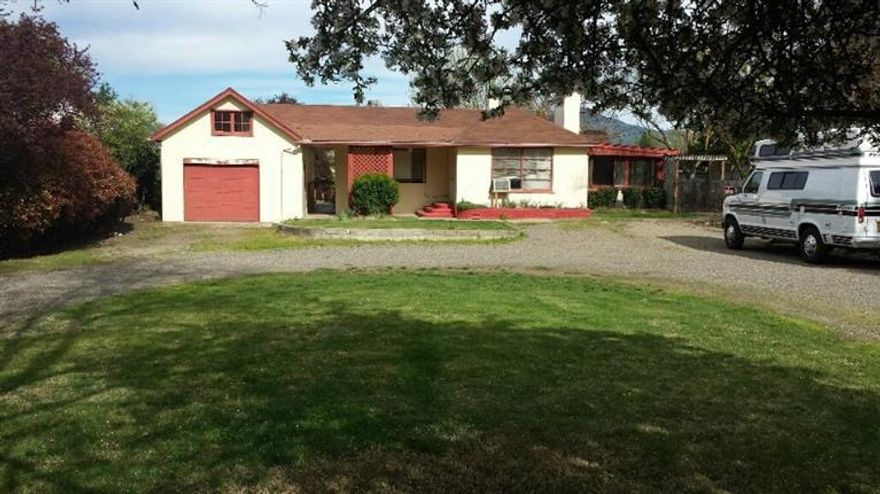 Great potential with this single story stucco cottage style home. Two bedrooms and two full baths in the main house with an additional bedroom/office w/closet attached to the one car garage. Full attic storage in the garage. Large laundry room and extra non conditioned living space not accounted for in sq ftg. In-ground sprinklers. Lots of room for gardening on this .43 acre lot. Zoned MFR-20 potential for apartments.