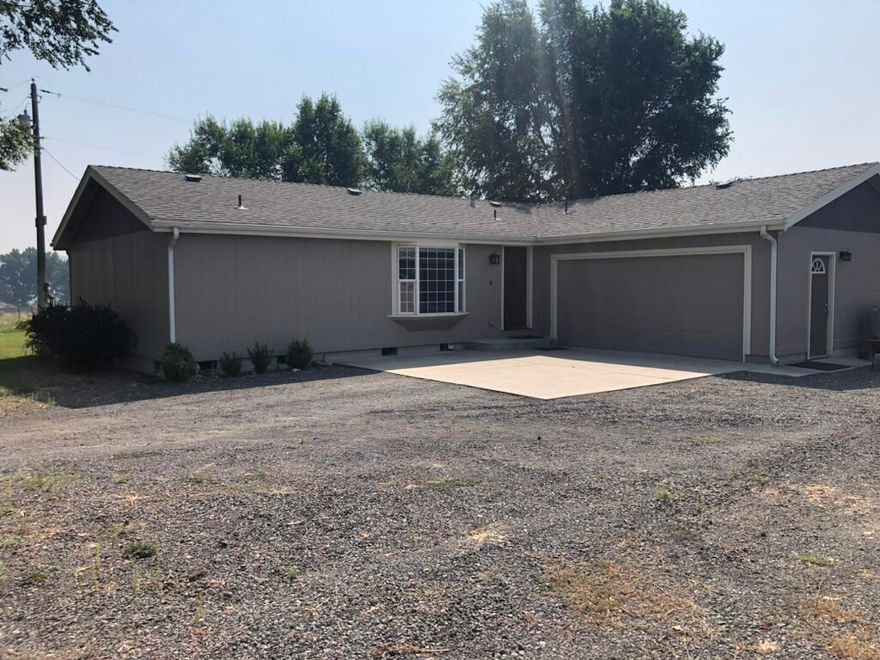 Income potential! Amazing 5 acre farm with 3 acres OID water rights & Cascade views available in coveted Green Valley Acres neighborhood! 3 bed, 2 bath PLUS guesthouse! 

The spacious 1,651 sqft MH main house offers an open split floor plan, wood flooring & trim, high efficiency mini split, walk-in closets, skylights, vaulted ceilings. Some of the updates to the main house include: LED lighting, whole house water filtration system, softener, and pressure tank as well as a new high efficiency heat pump and new stainless steel kitchen appliances. 

The detached 600 sqft guesthouse offers updated flooring, LED lighting, full kitchen & bathroom and is on a separate 200 amp service from the main house. 

The amenities continue outside including a 24x72' barn with customizable stalls, tack room & turn outs. A custom built fully fenced chicken coop. A 20x34' shop that is heated, insulated & wired with 240 volt power with a welder plug. The pasture is kept lush with OID water rights