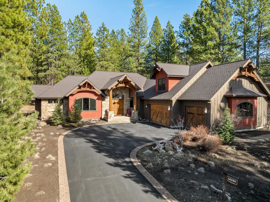 Experience European elegance in this custom-built Caldera Springs retreat, centrally located for easy access to all the amenities. A grand arched beam entry w/ stone accents welcomes you, with exposed beams flowing through the great room & onto the back covered paver patio w/ tranquil natural surroundings. Luxury abounds w/ a floor-to-ceiling stacked stone FP, hardwood  floors in the great room, & a dining area w/ wood-accented ceilings. The gourmet kitchen, a focal point for entertaining, features a large granite island & high-end appliances. The main level boasts 4 spacious bdrms, each w/ an en-suite bath, including a spa-like primary suite w/ a soaking tub & dual-entry shower. Upstairs, a bonus room or 5th sleeping area.  A/C, a hot tub, & a 3-car garage. Owners have access to Forestbrook, featuring a cafe, fitness center, water slides, pool, bowling, outdoor hot tub, & pickleball courts. Enjoy private walking trails,a lake for paddleboarding, & fishing & golf