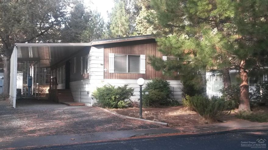 Great Location! Located in West-Side Pines Co-Op. This 1976, 1152 sq ft, 3 bedroom, 2 bath mobile only was weatherized & received a new rubber roof from Neighborhood Impact in 2014. The home has good separation of bedrooms, new carpet, covered entrances, carport, 2 storage buildings & a large back yard deck. Space rent is $466/month & includes water/sewer, garbage & yard debris pick-up. Come see this terrific home!