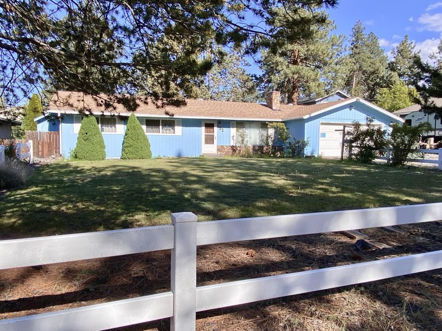 Close to Larkspur Recreation Center, Pilot Butte and Ponderosa Park with trails. 3 Bedroom 1 1/3  bath on .20 acre lot with plenty of RV parking nestled in the pines in SE Bend. Timeless stone gas fireplace in living room and primary includes stall shower with view of backyard, Home is ready for your own touches with updated windows and roof. Large deck in back with fenced yard and storage shed. Old Bend with larger lots and close to newer Reed Market amenities. Also connected to city sewer. Welcome to your new project to create your dream home with room for all your outdoor toys. Great lot with so much potential.