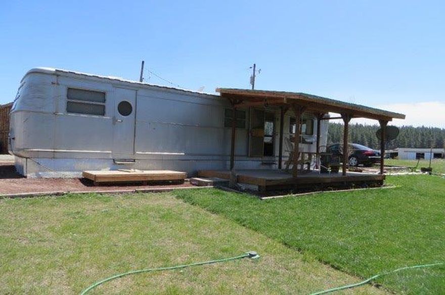 3.34 acres of level ground right on the world class fishing stream the Williamson River-162 ft of river front. A classic 1954 Spartan trailer with one bedroom, kitchen and living area, 336 sq ft. with its own lawn, deck, and storage sheds. A Place to hang out at and make memories, only $129,000.