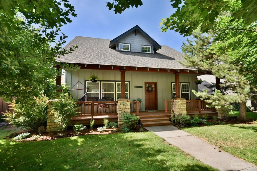 Imagine relaxing on the front porch of this darling craftsman style home. Located in Oakview, one of NE Bend's most desirable neighborhoods, it invokes the feeling of community and yesteryear with its tree-lined streets, inset sidewalks and alley access garages. Loaded with upgrades including hardwood flooring, slab granite & tile counters plus spacious bedrooms. Kitchen has been updated and includes stainless appliances including French door refrigerator. The remodeled master bath has a walk in shower, radiant heat flooring and huge closet with custom organizer system. The fully fenced backyard has a nice patio and privacy for relaxing and entertaining. Close to schools, parks and shopping. Call today to see this special home.
