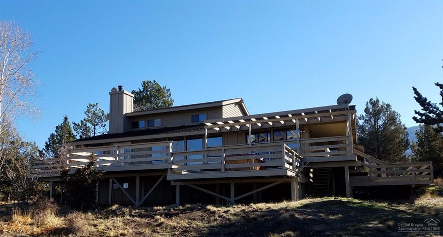 This spacious home in Powell Butte has some of the most amazing views of the Cascades, Smith Rock, the Ochoco's & the Powell Butte Valley that all can be enjoyed from the large wraparound deck accessible throughout the home. This home has large bedrooms, vaulted ceilings, real hardwood floors, solar tubes & a basement area that has been finished off as a game, hobby or rec room. Outside has an area for animals & a playhouse for kids. Large 2 car garage & plenty of useable land. Call for additional info.