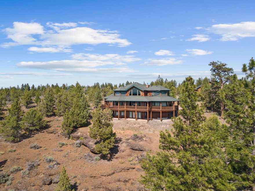 Custom built, high-quality construction home and shop (extra living space above shop) with BIG VIEWS. Features: Extensive and expensive woodwork throughout; High vaulted ceilings; Hardwood flooring throughout; Wood frame windows with numerous Cascade mountain views and meadow views; Main level primary suite; Large upper level office, large loft, two bedrooms and full bathroom; Lower level of the home is completely separate/private from upper two levels and could be a full apartment with its own private access. Large finished shop with a separate private apartment that also has big views. Includes an additional tax lot that extends all the way to the airport runway.