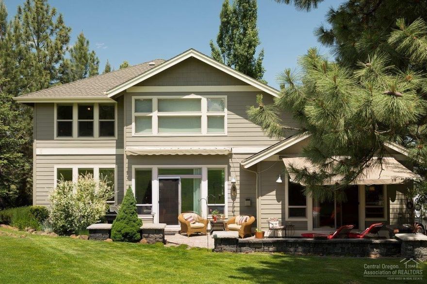 Custom home in Rivers Edge Village on the 17th Fairway. Great room with a stack stone fireplace, wood floors and views of the golf course. Stunning kitchen with granite, stainless steel appliances, travertine floors, island and pantry. Master is on the main with door to paver patio and has 2 walk-in closets. Master bath has dual vanities, travertine floors, soaking tub and tiled shower. Upstairs features 2 bedrooms, open loft and a finished 229SF room perfect for an office or storage. Home includes AC, Hunter Douglas custom blinds and more. Enjoy the back patio with retractable awnings. Tons of storage under the house.