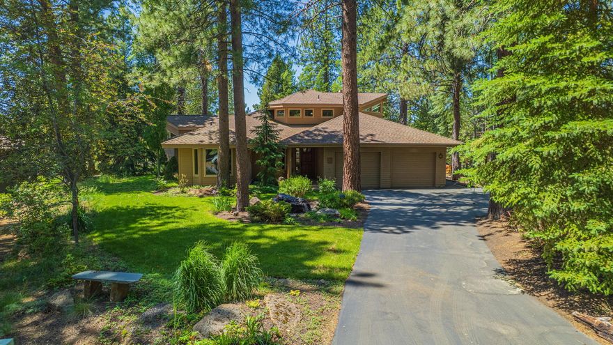 Welcome to this elegant 4-bedroom, 4-bathroom Sunriver home, spanning 2,822 square feet, that artfully balances space with a unique asymmetrical floorplan. Enjoy Northwest design rooted in natural elements of stone, wood & abundant natural light making a warm & inviting atmosphere, perfect for full-time living or a resort-inspired lifestyle. The heart of the residence, an expansive great room with living, dining & kitchen anchored together by wood floors, large hearth, wood-burning fireplace and built-in banquette. The main level has 3 bedrooms, 2 baths and an entertainment den while the primary suite is on the top level with a private sun deck. Outdoor space includes a wrap-around deck with built-in seating, paved walkway and a private hot tub patio, making it ideal for gatherings and relaxation. Seamlessly integrated in its surroundings, enjoy Central Oregon's blue skies amidst a manicured landscape, surrounded by ponderosa pines, aspen & fir trees. Unfinished basement for storage.
