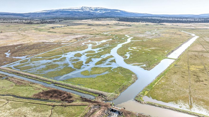 With 6,527± deeded acres & 4,500± acres of USFS & BLM grazing permits, the Deming Ranch is one of Oregon's best cattle ranching operations on the market today. Just outside of Bly, Oregon along the Sprague River, the location is outstanding. The ranch offers over 1,000± acres of irrigated meadows, pastures, & hay ground. With Deming Creek running through the property & a large portion of Campbell Reservoir situated on the ranch, all this live water makes this a dynamic ranch. Ranch headquarters, overlooking the Sprague River & valley meadows, include all the necessary improvements to run an efficient & productive ranch. These improvements include 2 ranch homes, bunkhouse, large hay barn with 4 stalls, & working corrals with a hydraulic squeeze chute. In addition, there is a nice mountain log cabin located on Deming Creek near the Deming Creek Wilderness Trail. This beautiful custom log home is a great hunting base or for hiking or horseback riding into the Gearhart Mountain Wilderness