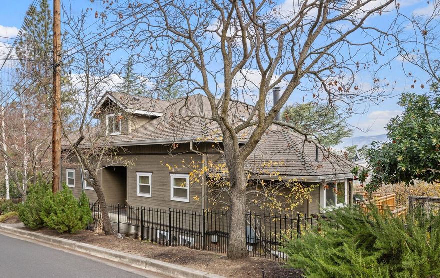 Stunning views of Ashland & only 2 blocks from the world renowned  Shakespeare Festival theaters, Lithia Park, restaurants & shops.  Lovingly renovated  in 2015 this 4 bdrm, 4 1/2 bthrm home is a real gem!  Dine on the beautiful 2022 deck overlooking the valley & Grizzly Peak. New carpet thru-out. Upscale kitchen w/built in Thermador appliances, granite countertops, island, travertine tile & hardwood floors. Large master suite w/bthrm,  views, walk-in closet, soaking tub/shower, on main floor w/ living room, dining room, 1/2 bath &  kitchen. Upstairs, 2 bdrms w/ views & bthrm. Apt-like set up downstairs w/frntrm, bdrm, bthrm. Also laundry room, additional extra guest space & 2nd bthrm. 3 access doors downstairs offer many potential uses, office, apt., 2 family set up & possible ADU (w/ own due diligence) Large lot. New landscaping. Yard is private, quiet & fully fenced. Expansive 1/2 circle driveway is envy of neighborhood! Lots of parking w/50AMP electric chg.