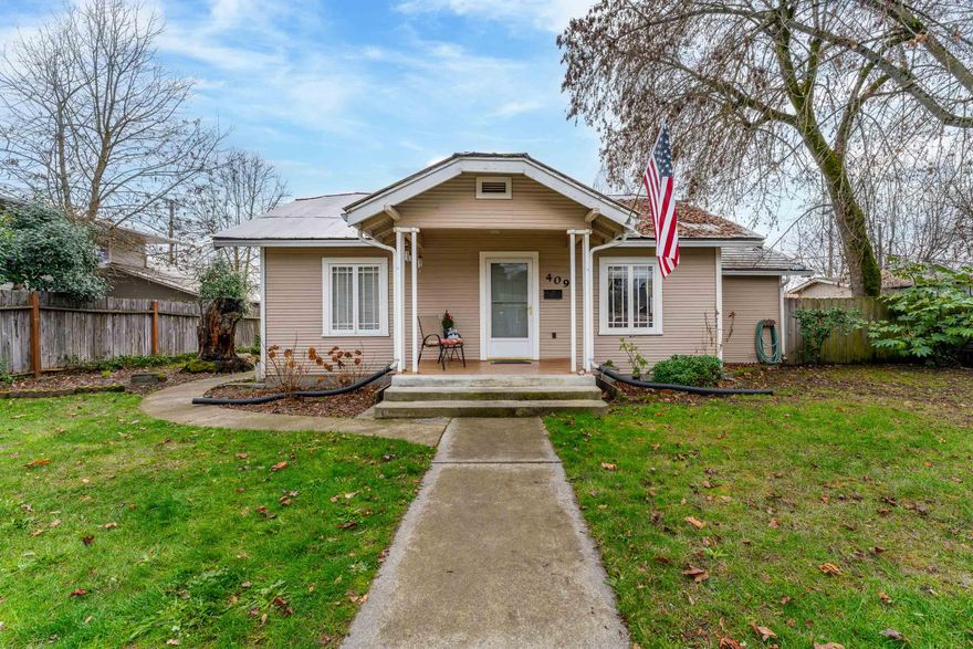 Charming 2 bedroom, 1 bathroom home in the heart of Grants Pass! The unique character honestly makes the home stand out. This home would make for a wonderful starter home or investment property! Enjoy the spacious, fully fenced yard and detached garage with alley access. Large back yard patio with sidewalks to garage and alley parking. The property is zoned R-4. convenient to shopping, restaurants, and more. All information is deemed reliable. It is suggested that any one considering the purchase of the property, perform due diligence regarding the uses and condition of the subject property