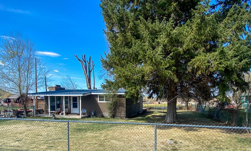 Lots of character in this cute 2 bedroom 1 bath home on .26 acre lot. Nice sized kitchen with plenty of cabinets, wood beam vaulted ceilings in the living room with a fireplace. There is an attached 192 sq ft storage room attached and a detached shed, large back deck and large yard with lots of mature trees.. Close to the hospital,
shopping and eateries.