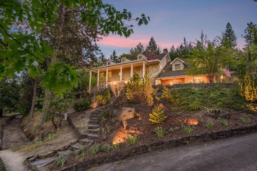 Located a mile from downtown in the hills of the quaint town of Ashland, Oregon is this extensively remodeled and updated estate. Featuring Brazilian wood floors, 4 fireplaces, spacious living, dining & family rooms. Perfect for all season entertainment & the active family. Remodeled in 2020 the luxurious master suite and attached office is the perfect work from home space, with 16ft vaulted ceilings, radiant heat limestone floors, walk-in closets, steam shower & infinity tub. Additional 4 bedrooms, newly remodeled Japanese soaking tub and powder rooms, library, professional bar, stunning chef's kitchen w/ high end appliances and an amazing view. Step outdoors into recently built rock patio, relax near the swimming pool and hot tub surrounded by meticulous landscaping & 30ft Rogue River rock waterfall, 3 car garage, unmatched access to miles of biking and hiking trails from lower portion of the property. Ashland offers highly rated schools and a safe community!