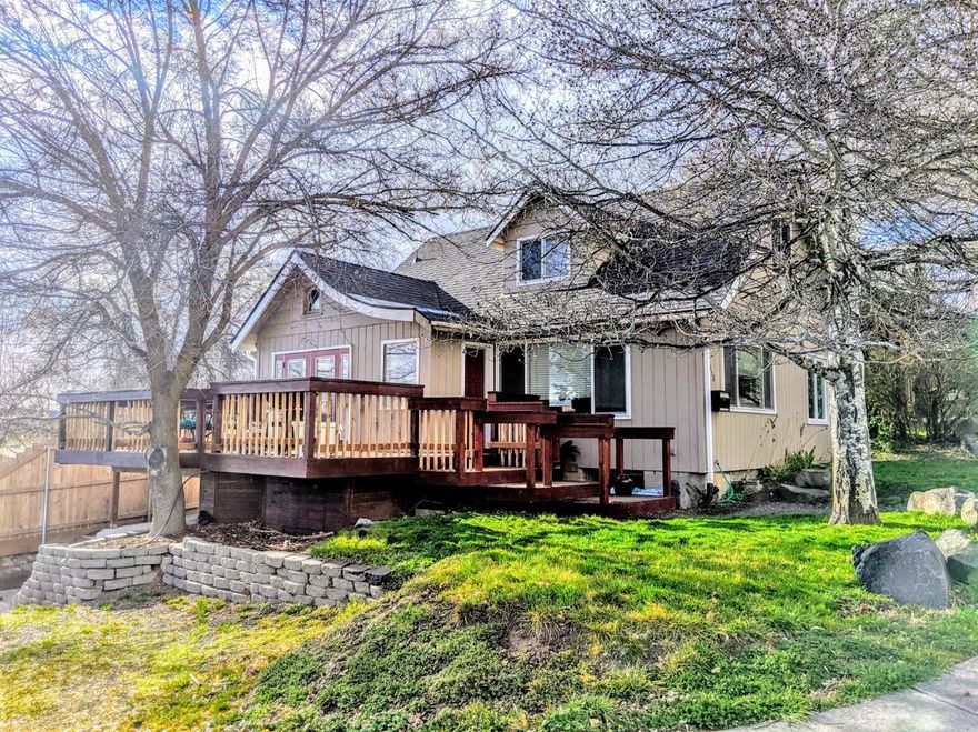 Beautiful 3 Bedroom 2 bath home on a corner lot features a finished basement with kitchenette and bathroom. Nice low maintenance yard and large deck with a wonderful view overlooking the city. Updated kitchen cabinets, tile and hardwood flooring in main areas. Located in hot springs area for possibility of geothermal. Listing agent related to seller.