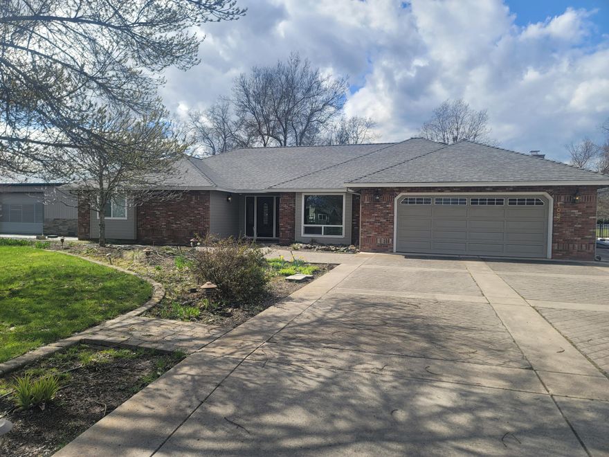 This stunning three-bedroom, two & 1/2-bathroom ranch-style home with an office offers 2,669 sq. ft. of single-level living. Remodeled in 2015, it features a chef's kitchen with a Wolf range, Monogram hood and oven,  Sub-Zero refrigerator, and leathered granite counters that carry over to the family room fireplace. A walk-in pantry, laundry room, and spacious dining area with backyard views add to the charm. The master suite boasts a cedar-lined walk-in closet and a spa-like bathroom with a tiled double shower.
Outside, enjoy a indoor saltwater pool, firepit courtyard, and equestrian amenities, including a three-stall barn plus tack room, 60' x 120' covered arena, turnout, and wash rack. A ''chicken palace'' houses up to 30 hens, while fenced pastures and hay storage sit to the north. The property also features an attached two-car garage, a 4-car shop with a man cave, and an additional workshop. Ideal for horse enthusiasts, mechanics, or those seeking the ultimate country retreat