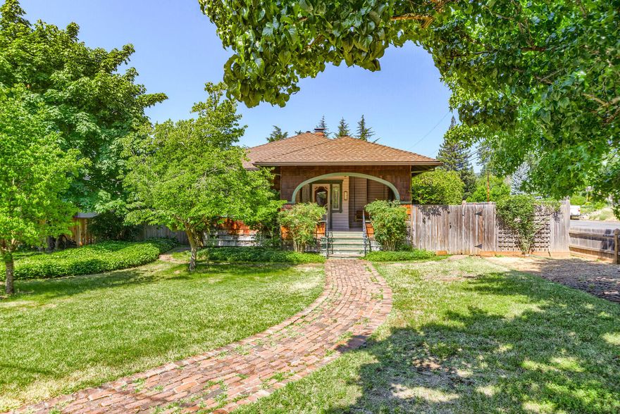 This home has all the character and charm you would expect in the sought after NW neighborhood. Located close to downtown and the wonderful historic district of Grants Pass with two bedrooms, one bathroom this home is 1,120 square feet on a large corner lot. The wood burning fireplace adds a nice ambiance as well as the unique and stunning window features. It's accommodated with large front and back porches nice for outdoor relaxing or dining. The backyard has a fragrant rose garden plus room to add another small garden or landscaping to make it your own. RV parking is available! The two car garage includes a half bathroom and is set up for a shop area. There is a storage shed perfect for an atv or boat that blends in nicely with the fence as well as a 'She Shed'' for possible office or additional storage. There is so much potential to make this house feel like home. Make an appointment today!