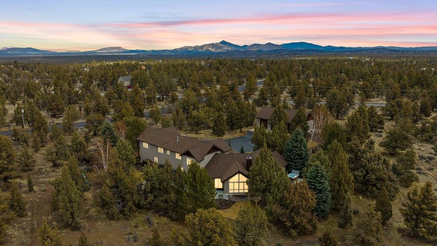 Stylish Craftsman home on 4.93 acres in the coveted Crestridge Estates. Vaulted entry leads to an open living space filled w/natural stone, rich woodwork & rustic accents. Main living area ftrs wood beamed vaulted ceilings, cozy wood burning fireplace w/hearth & mantle adorned by built-ins on both sides, floor to ceiling windows & dining area. Chef's kitchen ftrs custom cabinetry, granite counters, built in oven, propane cooktop w/pot filler, island w/prep sink, brkfst bar seating & adjacent family room. Main level primary suite w/private deck/hot tub, tiled bath ftring dual sinks, tiled shower, & massive walk-in closet. Upstairs features a Jr Suite, two addtnl bedrooms w/jack & jill full bath. Bonus room w/wet bar, 1/2 bath & space to make your own. Well appointed laundry just off the triple+ garage. Sprawling deck for year round entertaining, paver pathways, water feature, outdoor firepit area w/propane starter. Finished & heated 3 bay RV garage/shop, tons of storage + much MORE!