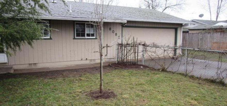 Modest older neighborhood, convenient to schools, shopping, and outdoor recreation. One level, three bedroom, one bathroom, open and compact style, with attached two-car garage. Large fenced backyard and fenced front yard.