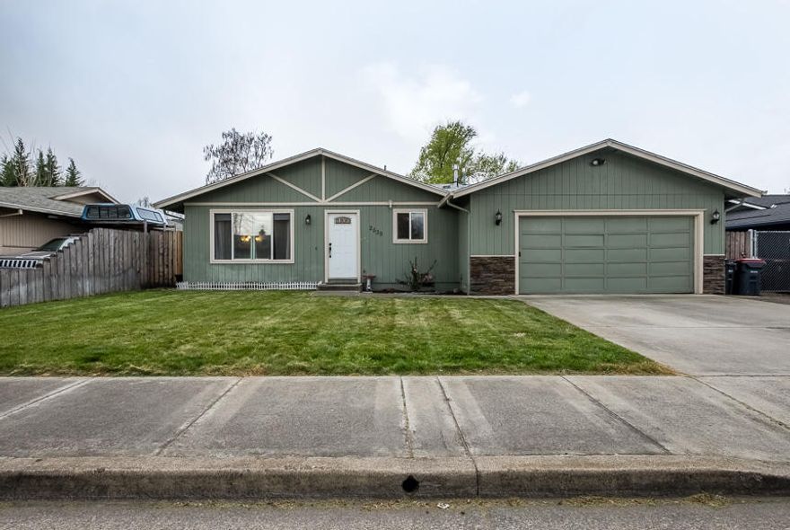 Cute as they come! This 3 bed 2 bath 1288 SQFT house sits on a large .15Ac lot in NW Medford with lots of parking. Inside you will find a functional layout, open kitchen, with granite countertops and stainless steel appliances, fridge included.  The three bedrooms are all good sized and the master has a private bathroom with a tile tub/shower.  The large, fenced backyard has mature trees, plenty of grass, a patio area perfect for entertaining and room for a fire pit. Don't forget to check out the 3D tour!