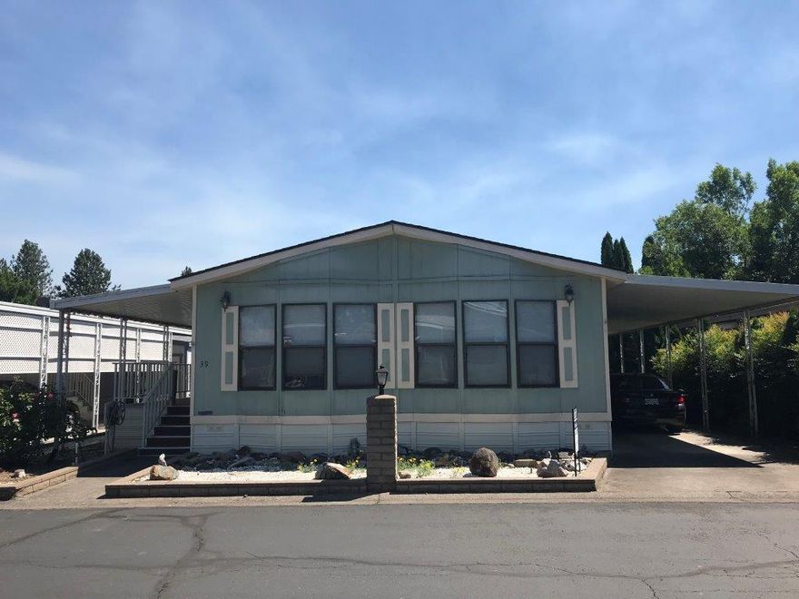 Doublewide, well cared for mobile home in the 55+ Leisure Days Park in Shady Cove. No maintenance lot and a beautiful deck and patio area. All appliances included in sale. Home is being sold as-is, but don't let that deter you, this mobile is in great shape. Mobile park amenities include Rogue River access and barbecue area.