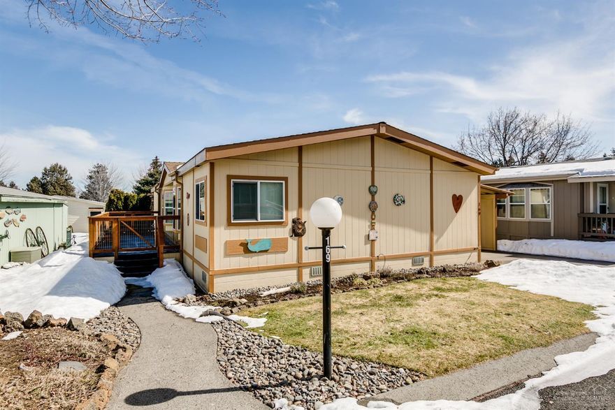 Spacious move-in ready home in a 55+ park Suntree Village. This home features vaulted ceilings, huge living room, dining room & cozy kitchen with breakfast bar. This lovely home has been upgraded: roof, furnace, all windows, hot water heater. Fenced backyard with private patio to enjoy views of Pilot Butte. Great deck at entry. Carport with shop, lots of storage! Owner pride throughout. A must see!
