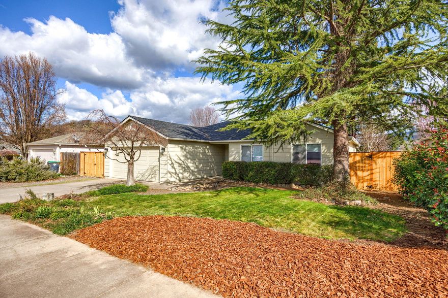 This lovingly maintained single level home with newer roof and HVAC system is move in ready.  You're sure to appreciate the rare 'in-town' mountain views from the dining and living rooms. The kitchen offers tile flooring, solid surface countertops, plenty of cabinet storage and is conveniently located next to the tiled dining area. The vaulted living room with stunning hardwood floors and large picture windows lets in amazing natural light.  All three bedrooms are good size.  The primary suite is quite the surprise. Roomy bathroom w/ tiled flooring, a true walk-in tiled shower and a custom wood vanity.  The backyard has covered and uncovered patio spaces, a garden box , a storage shed and plenty of space to entertain. Two car attached garage and plenty of off-street parking. Welcome home!