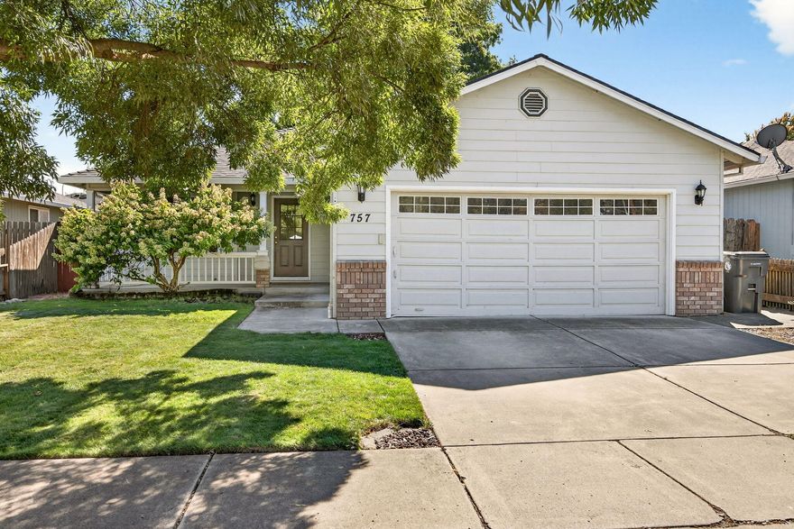 Quality-built by Mahar Brothers Construction, this move-in ready gem is located in the highly sought-after Griffin Creek School District!  Meticulously maintained, this home offers peace of mind, with major recent updates including a brand-new roof (2024), a new heating and air system (2023), and the water heater replaced in 2018. The open floor plan features beautiful solid oak hardwood flooring throughout the living, dining, and kitchen areas, creating a warm and welcoming atmosphere. The island kitchen is ideal for both everyday living and entertaining, while the charming front porch adds great curb appeal.  Exit out to the lovely backyard with a relaxing patio and deck.  Finished two-car garage offers nice storage, and the indoor laundry room adds convenience and functionality. Don't miss this exceptionally cared-for home in a prime location!