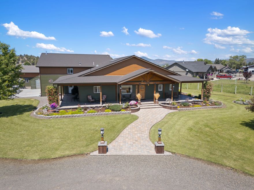 Take a moment to peruse the peaceful setting of this custom home. Located in a small acreage community, on a dead-end road, surrounded by rolling green pastures and a view of Barnes Butte. Custom home completed in 2018 includes 3 primary suites, main primary includes office space, access to wrap around porch. Bathroom with double vanities, jetted soaking tub, separate shower and large walk-through closet that takes you directly to the laundry room. Extra attention to detail in all the beautiful wood finishes throughout the home including custom cabinetry; additional custom features include built-ins with lighting, doors with immense character, cabinets with outlets to charge appliances and so much more! Builder thought of all the details with half bath in the garage/workshop; foundation at edge of wrap-around porch for easy addition to floor plan, spider insulation, finished attic storage with temperature control. Separate 40x30 insulated shop, 40x16 lean-and 40' storage container.