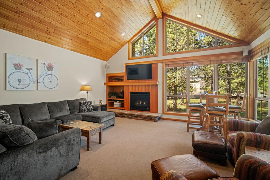 Welcome to your Sunriver retreat! This well-appointed, turnkey 3-bedroom townhome in Fremont Crossing offers a spacious primary suite and a junior suite making it perfect for full-time living or vacation getaways. Ideally situated as a center-row end unit, you'll enjoy added privacy and natural light from the many windows and wood laid vaulted ceilings in the great room. The oversized dining table makes for a central gathering place overlooking the back deck. Step outside to your private deck with a hot tub. Just imagine relaxing after a day of Central Oregon adventure, don't forget to check out the stars! As a center row unit there's room to play too - bring out your yard games and soak up the summer sun! Whether you're strolling to Sunriver Village for dining & shopping or biking to the Nature Center & Observatory, you're just minutes from everything Sunriver has to offer. If location is what you're looking for - this is it!