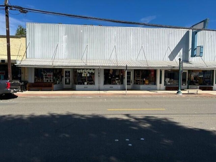 Versatile retail location on Spruce Street in Myrtle Point.  The building has two separate front entry doors.  Located just off Hwy 42.  The property is zoned Commercial Residential.  Listing agent is related to selling company's manager.